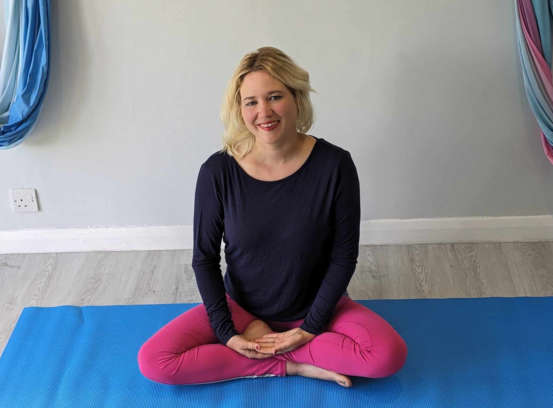 Holly teaching a supportive yoga class in Bookham